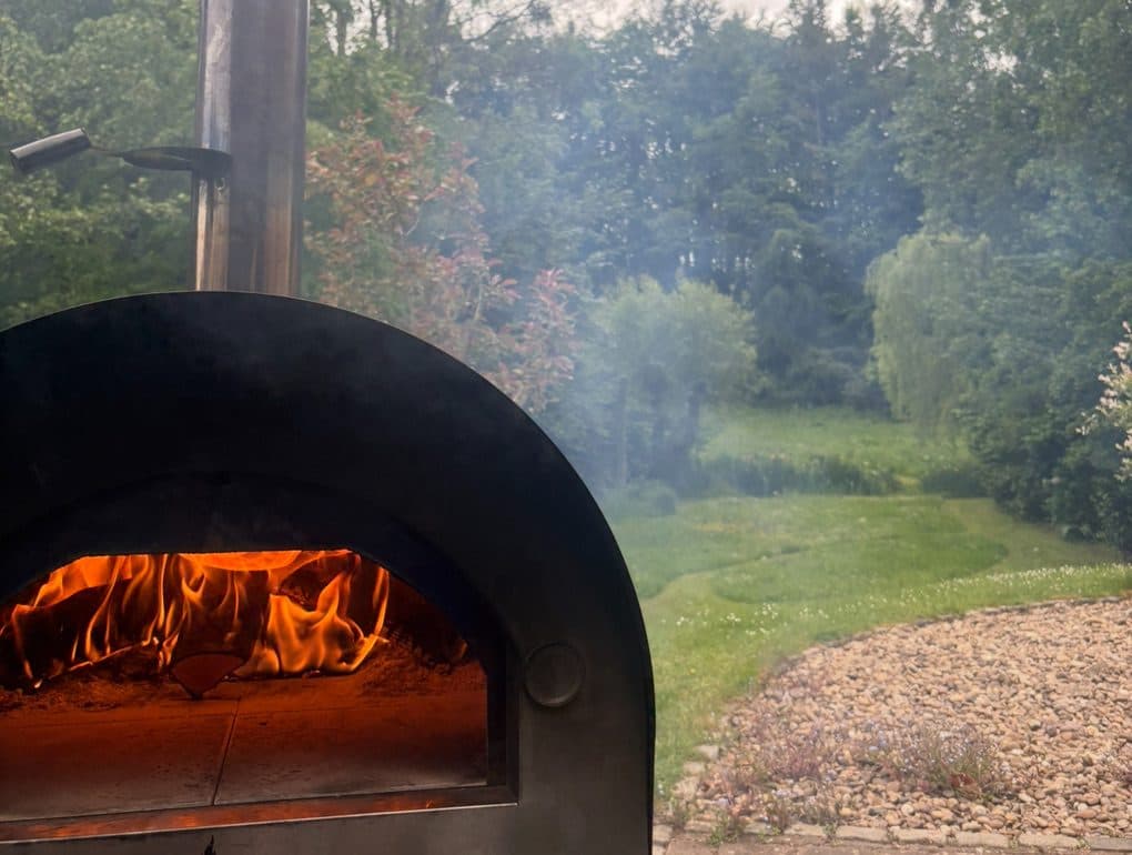 Mobile pizza oven setup for a private garden party in Gloucestershire