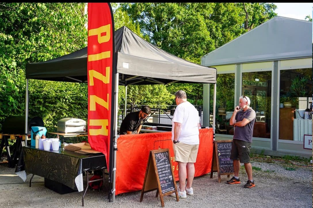 Pop-up pizza catering stall at an outdoor festival in Gloucestershire