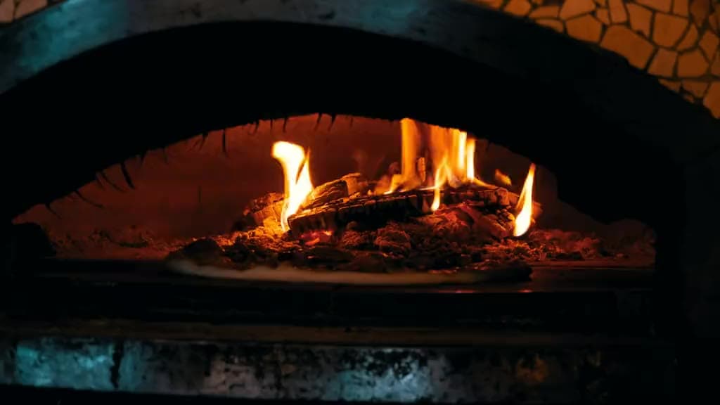Flames inside our wood-fired oven at an event